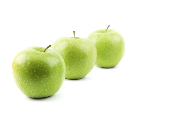 Isolated perspective of three green apples — Stock Photo, Image