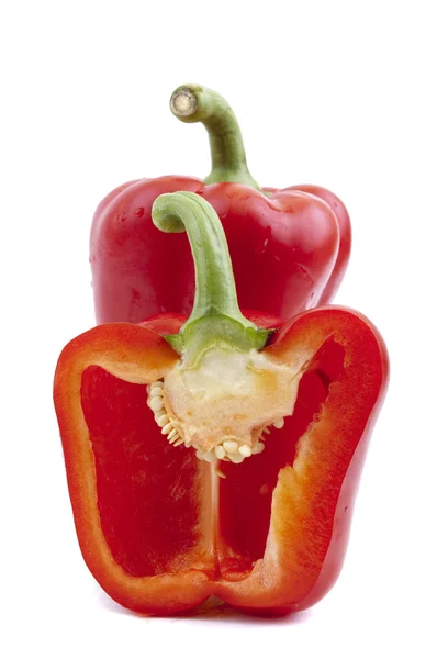 A red pepper and half of the pepper — Stock Photo, Image