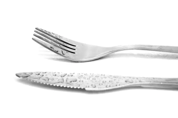 Tenedor y cuchillo sobre fondo blanco —  Fotos de Stock