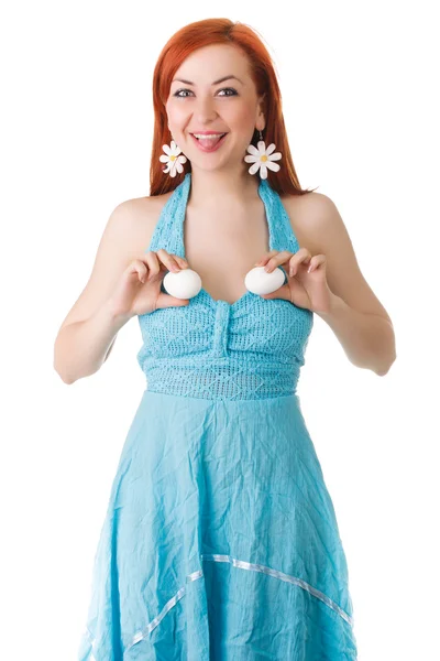 The girl holds chicken white eggs in both hand, at the level of the breast. — Stock Photo, Image