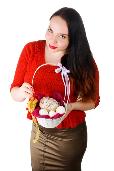 La chica sosteniendo en la mano una cesta con pasky y huevos — Foto de Stock