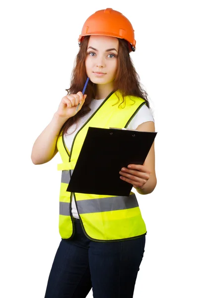 Das Mädchen der Bauarbeiter mit dem Helm und der Weste mit dem Tablett für Papier und Stift in den Händen. Es ist isoliert. weißer Hintergrund. — Stockfoto