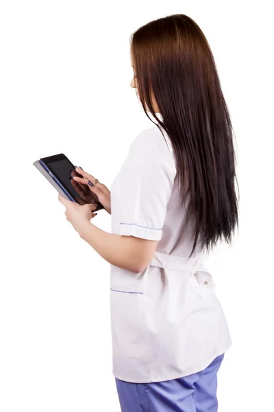 Medicinsk flicka arbetare med elektroniska tablett i händer — Stockfoto