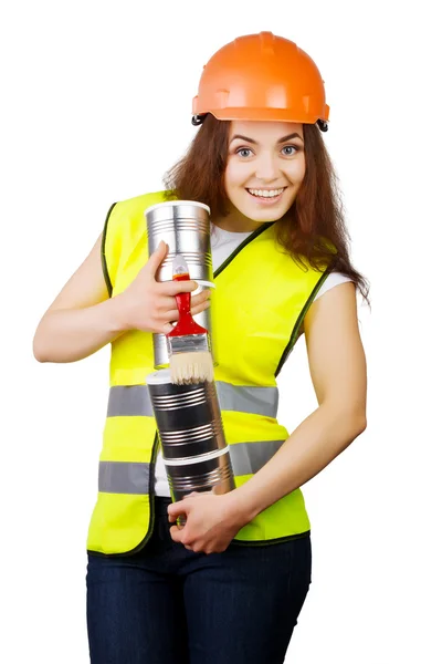 Girl in overalls and a helmet with metal cans and a brush in hands. isolation. — Stock Photo, Image