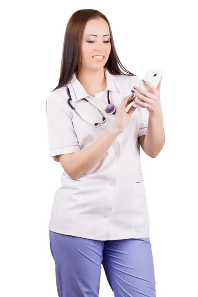 Mujer joven médico con teléfono móvil . —  Fotos de Stock