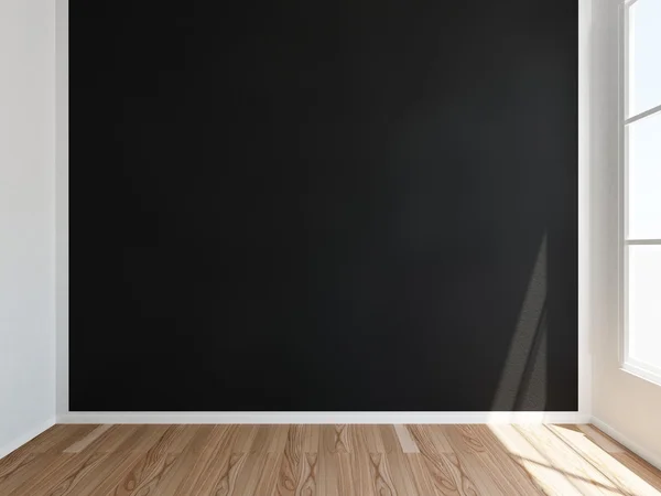 Номер с черной стеной и деревянным полом — стоковое фото