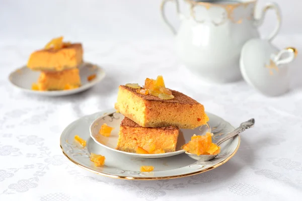A piece of pumpkin cake with candied fruit — Stock Photo, Image