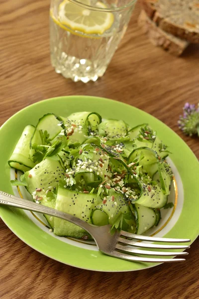 Cucumber salad with flax seeds, sesame and poppy — Stock Photo, Image