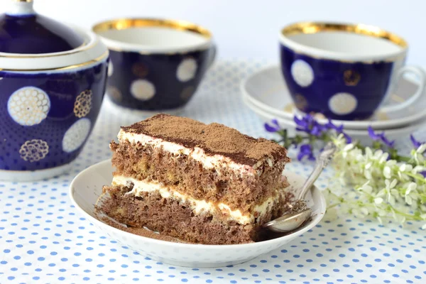 Slice of sponge cake with sour cream — Stock Photo, Image