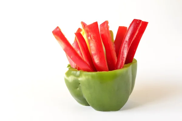 Slices of sweet pepper in the stand of pepper — Stock Photo, Image