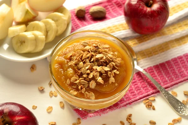 Pumpkin mousse with bananas, apples and granola — Stock Photo, Image
