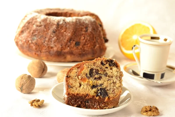 Pudding with dried fruit, nuts and coffee, cupcake — Stock Photo, Image