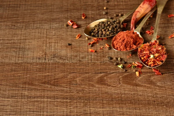 Dry spices in old spoons — Stock Photo, Image