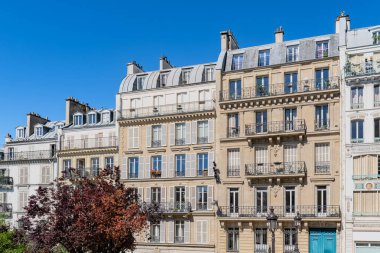 Paris, typical facades, beautiful buildings with old zinc roofs, rue Fenelon