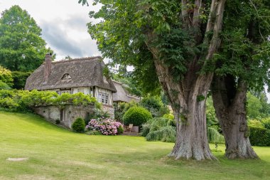 A thatched cottage in Normandy, on the banks of the Seine, beautiful house clipart