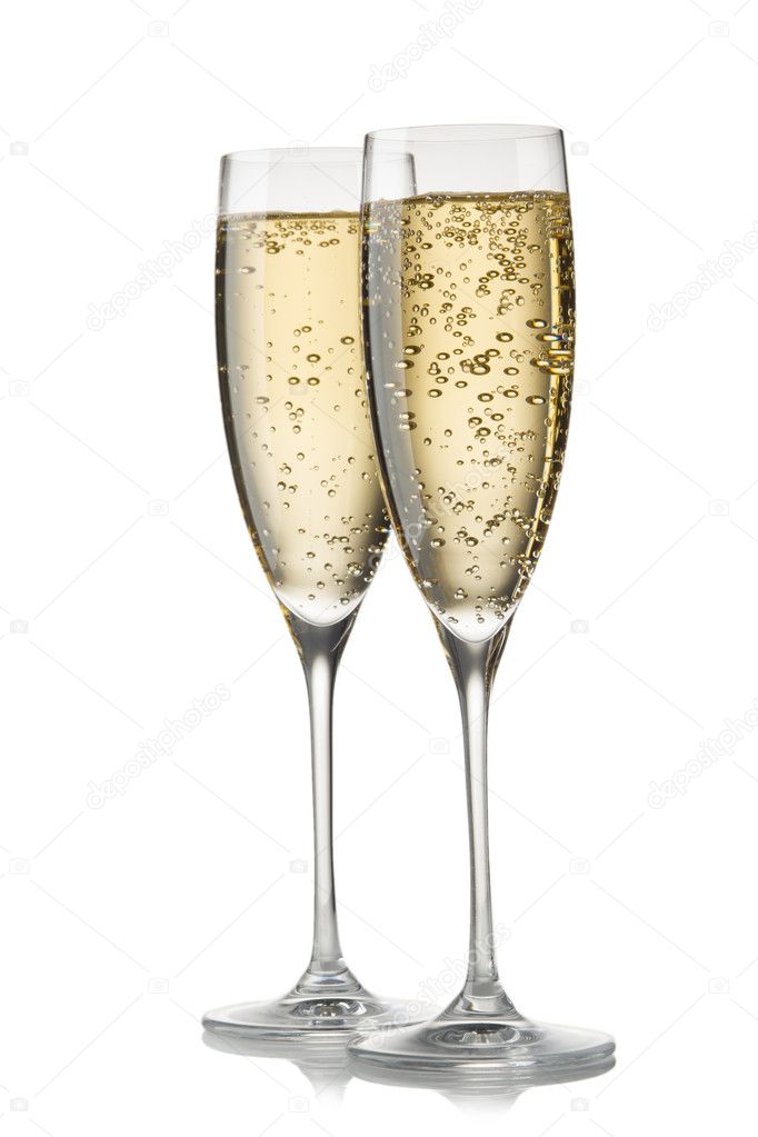 A glass of champagne, isolated on a white background.