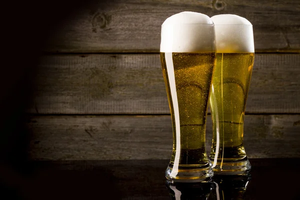 Two glass beer on wood background with copyspace — Stock Photo, Image