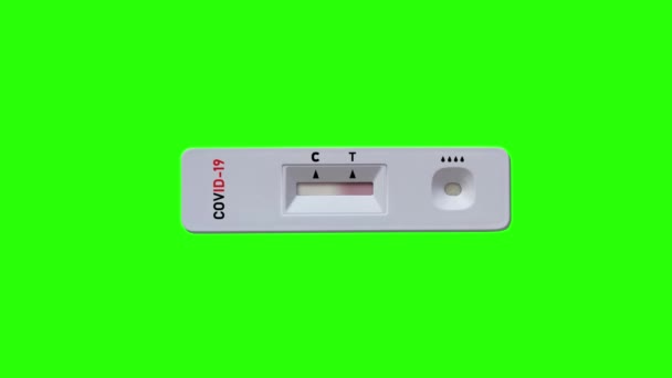 Test unit for covid with negative result on green background — Stock Video