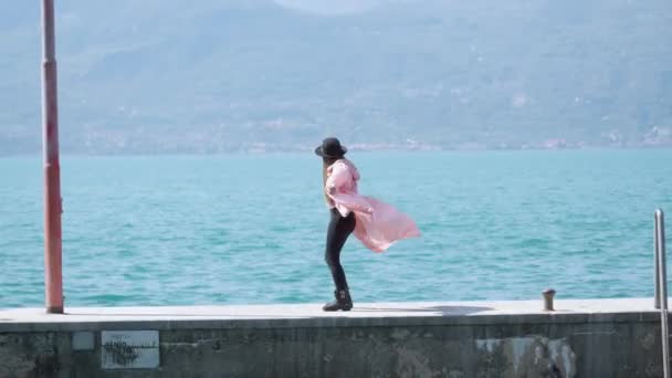 Happy Woman Enjoys Dancing Pier Lake Garda Clear Blue Water — Stock video
