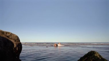 Model lying on the sea
