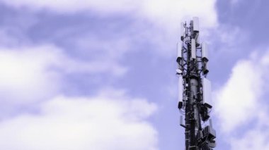Satellite telephone antenna on the sky with clouds