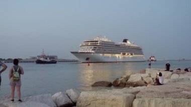 August 2021. Viking Sea cruise is towed in the port of Chioggia
