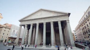 ROME, ITALY - MAY 12 2022: Ancient Pantheon with large white columns on square in center of Rome under blue sky. Historical architecture in touristic Italian city on May 12 in Rome