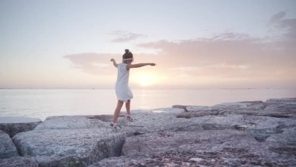 Little Girl Walks Stones Dike Having Fun Sunset Lagoon — Vídeo de Stock