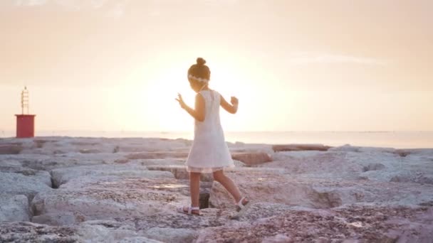 Little Girl Walks Sunset Dike — Stock Video