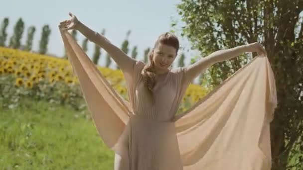 Woman Elegant Dress Blowing Wind Front Sunflower Field — Stock Video