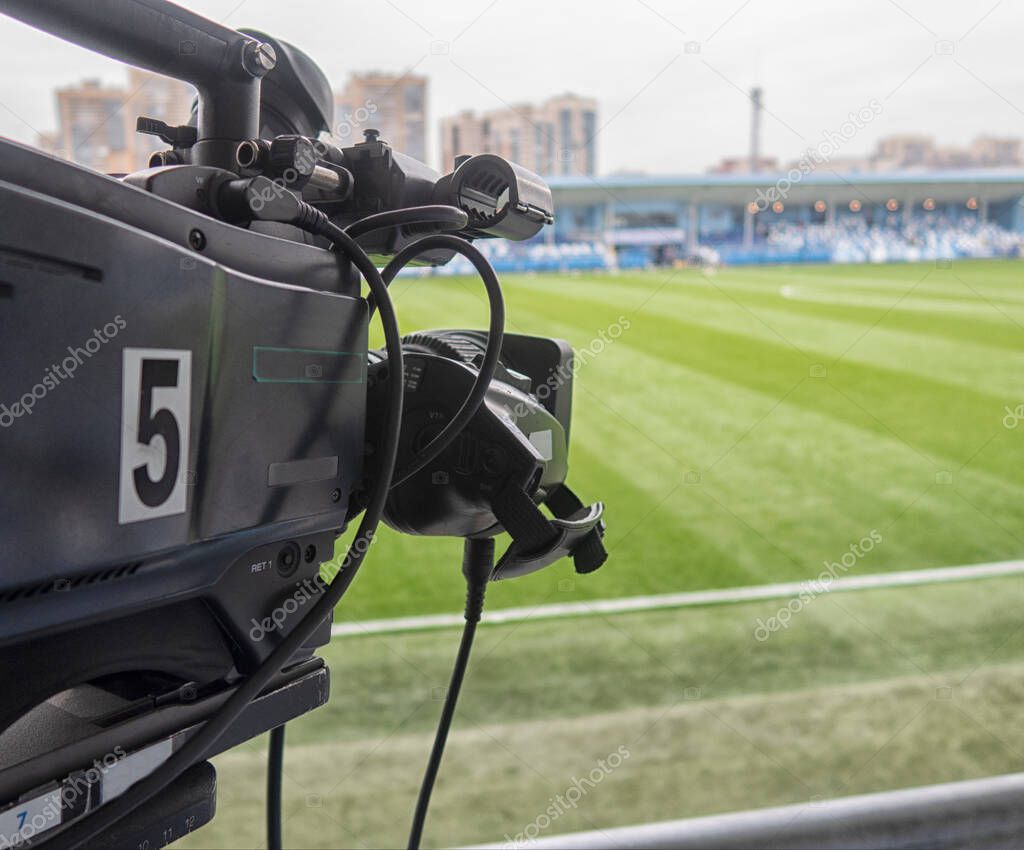 Set up and preparation video camera before the event on football tournament for professional photographer filming video or television broadcasts