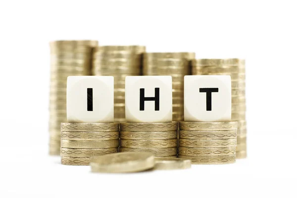 IHT (Inheritance Tax) on gold coins on white background — Stock Photo, Image