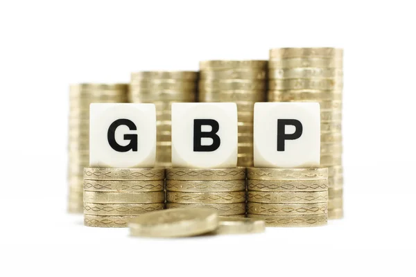 GBP (Great Britain Pound) on gold pound coins on white backgroun — Stockfoto