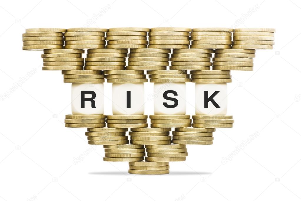 Risk Management Word Risk on Unstable Stack of Gold Coins