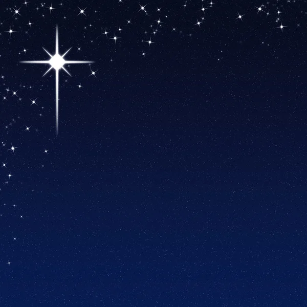 Yıldızlı gece gökyüzü arka plan üzerinde Noel yıldızı Telifsiz Stok Imajlar