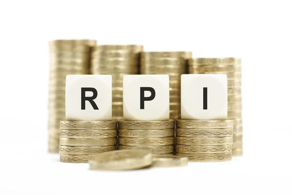 RPI (Retail Price Index) on Coin Stacks Isolated White Backgroun — Stock Photo, Image