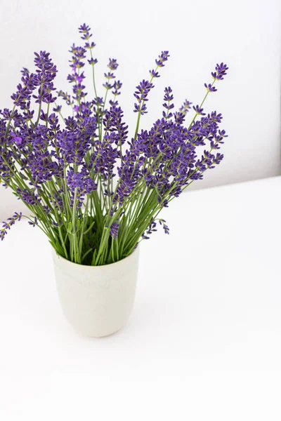 Beautiful summer lavender flowers in a vase, part of a home interior