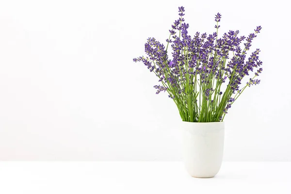 Beautiful summer lavender flowers in a vase, part of a home interior