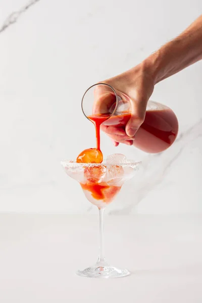Man Pours Alcoholic Drink Tomato Juice Glass Ice — Zdjęcie stockowe