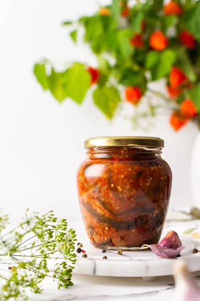 Preserving vegetables for the winter, canned chopped eggplant with carrots and tomatoes, copy space