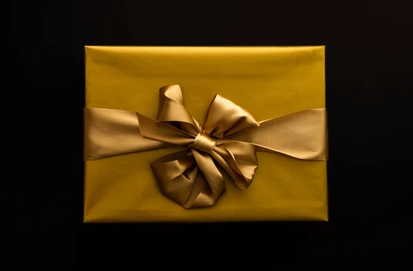Gift Box Golden Wrapper Bow Close Black Background — Stock Photo, Image