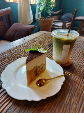 Coffee with cake At a coffee shop by the river in Thailand.