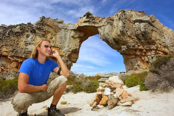 Young man talks over phone — Stock Photo, Image