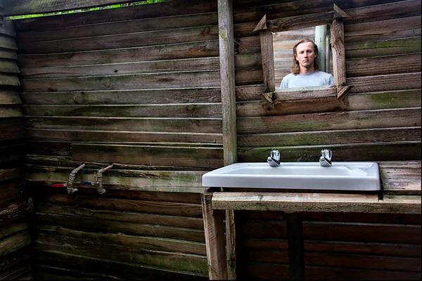 Mirror with man's reflection — Stock Photo, Image