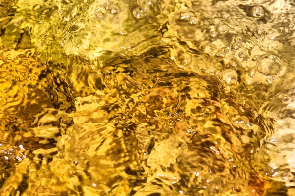 Texture of the golden-color spring surface - light — Stock Photo, Image