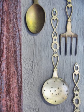 Vintage silverware on rustic wall clipart