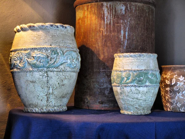 Set of vintage pots on blue table — Stock Photo, Image