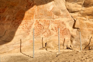 Wall in the Elands Bay cave with rock art clipart