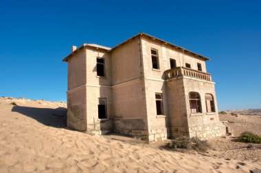 Abandoned house in sand
