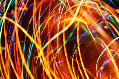 Soyut renkli ışık çizgileri arkaplan, parlak ve canlı renklerle dolu dinamik resim.